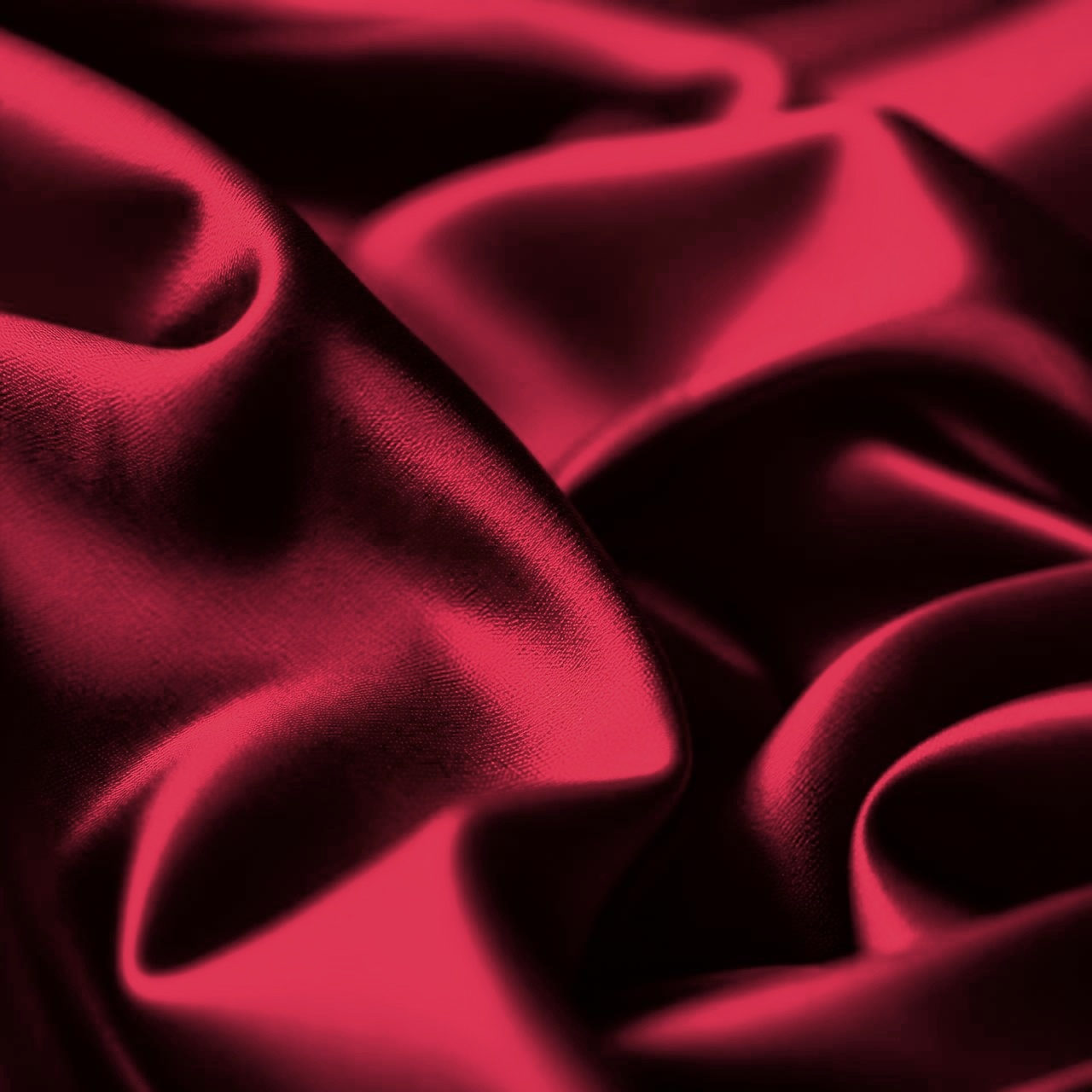 Macro detail of rouge mulberry silk folds